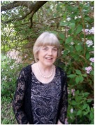 A person smiling in front of a treeAI-generated content may be incorrect.